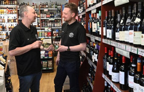 From left: Jim McQueen and Steve McQueen inside their Aberdeen store